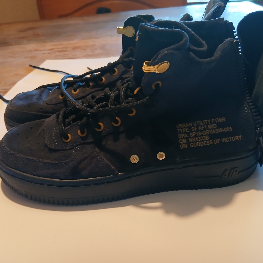 Nike Black Sneakers with Silver Logo
